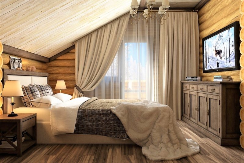 Спальня в доме из оцилиндрованного бревна