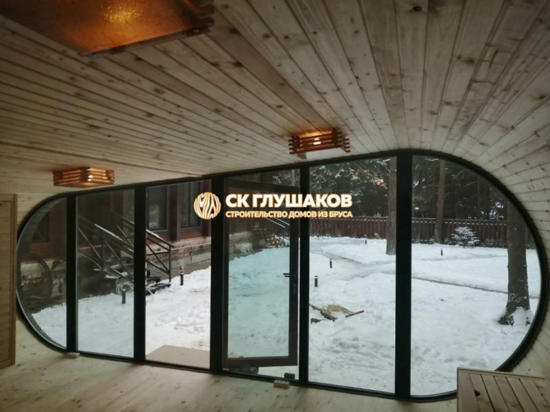 Овальная баня с панорамными окнами